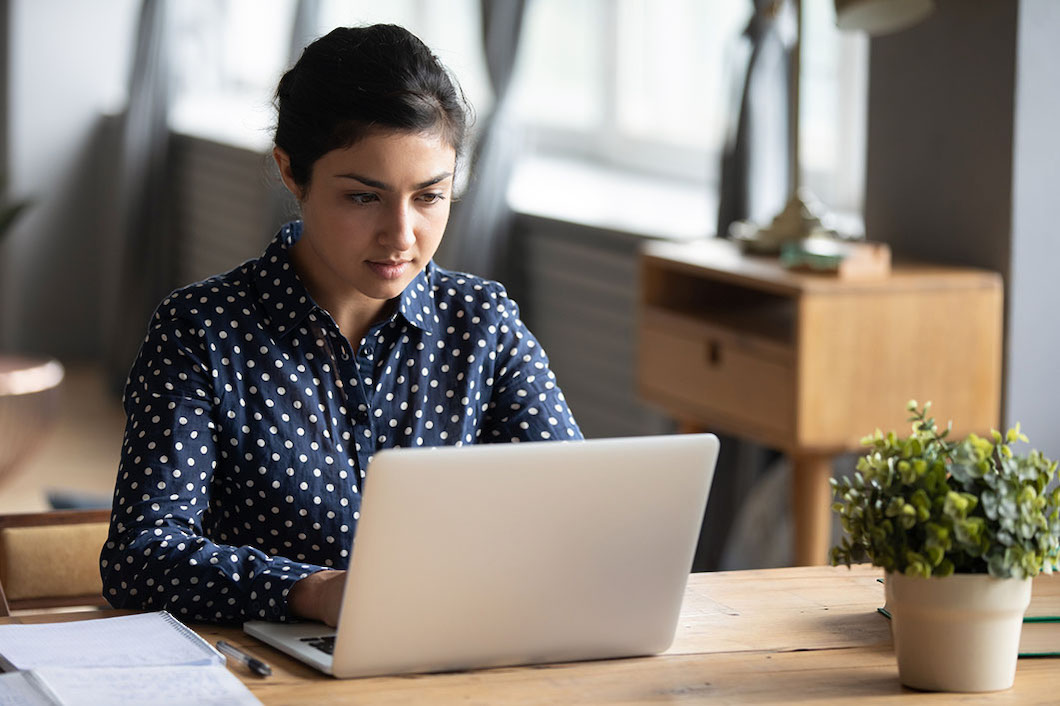 Woman focused on laptop